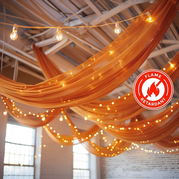Terracotta chiffon drape panel on a wedding arch